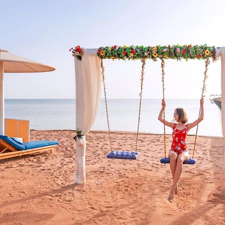 Pickalbatros Laguna Club Resort Sharm El Sheikh Exterior foto A swing at the beach